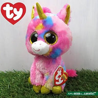 Beanie boos peluche ty unicorno fantasia rosa e blu con corna oro e occhi glitter seduto su erba artificiale
