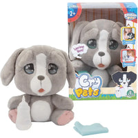 Plush cane peluche grigio e bianco soft emotion pets cry seduto accanto alla confezione pets cry pets