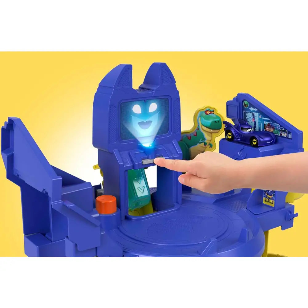 Blue plastic batcaverna lancia sfreccia playset with glowing ghost face screen and purple car ramp from fisher-price dc batwheels