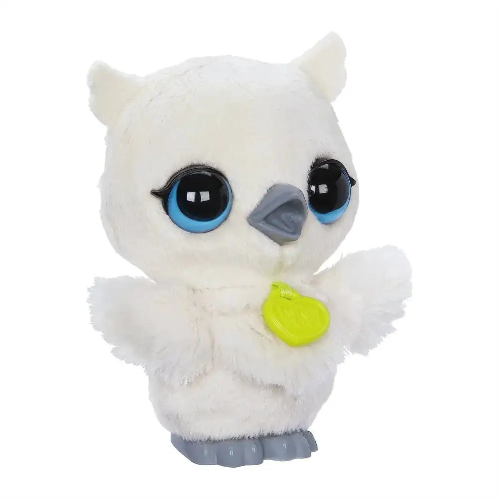 A plush white owl toy with blue eyes gray beak and feet and green heart tag from furreal friends luvimals gufo