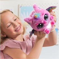 Pink plush unicorn toy with rainbow wings and glowing face from hatchimals alive uovo mystery hatch pufficorn collection