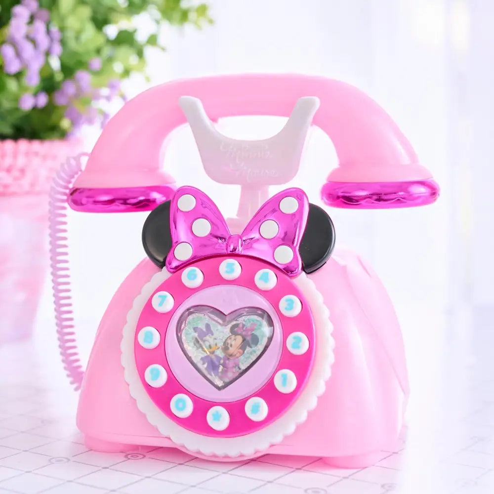 Telefono rotante minnie mouse in plastica rosa con fiocco magenta e finestra a forma di cuore con personaggi disney