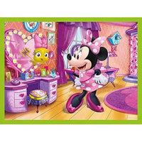 Minnie puzzle cubi con abito rosa a pois bianchi, guanti bianchi e fiocco coordinato sulla testa