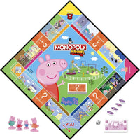 Peppa pig monopoly junior board game with colorful property spaces, cartoon illustrations, and pink plastic player pieces