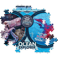 Puzzle national geographic ocean explorer con motivi di polpo meduse e navi in colori blu viola e rosso vibranti